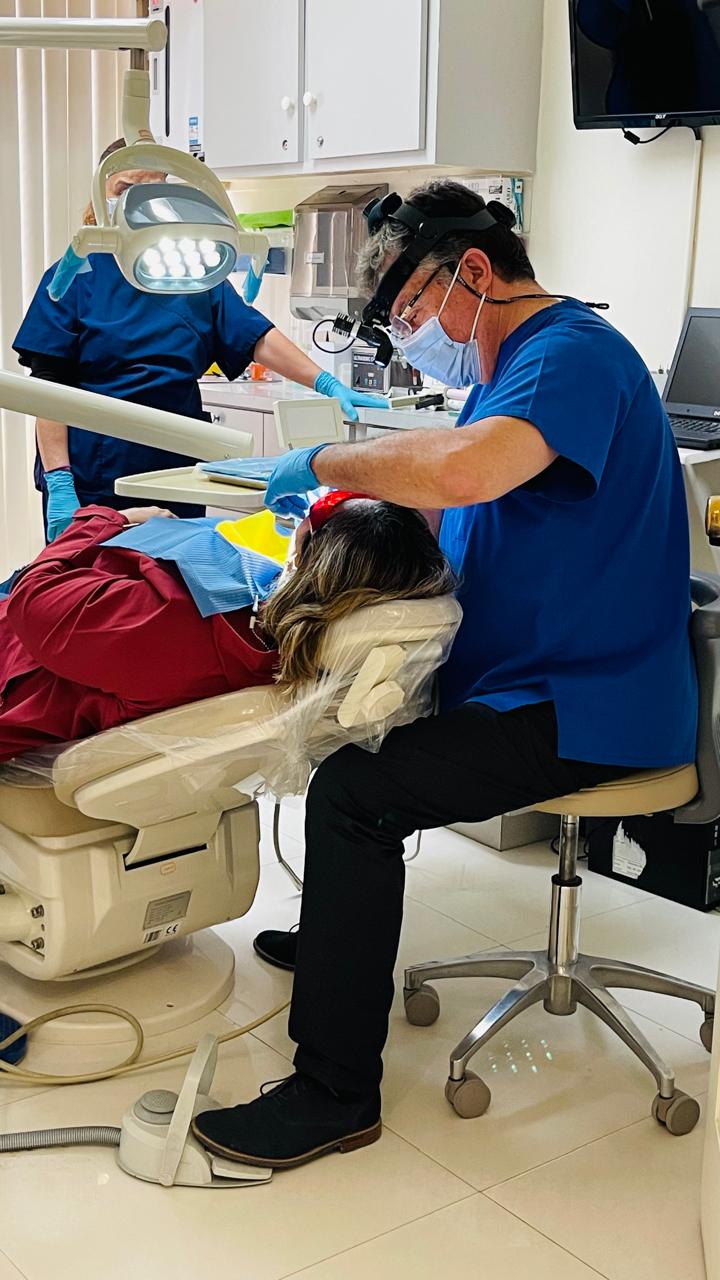 Dentist providing attentive care to a patient