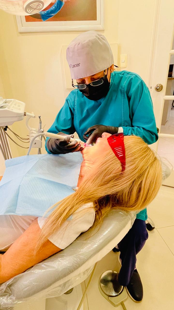 Clinical team member assisting during a dental procedure